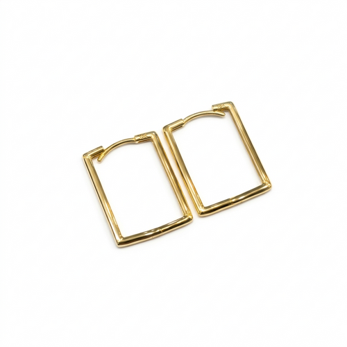 Gold hoop earrings on a white background
