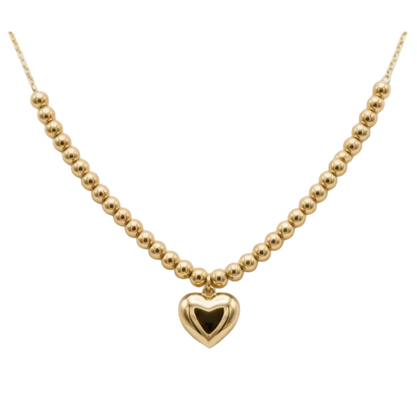 Gold necklace with a heart pendant on a mannequin bust.