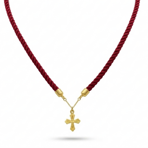 Red cord necklace with a gold cross pendant on a white background