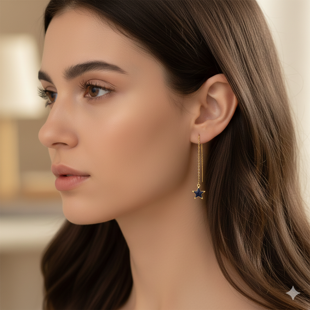 Woman wearing gold star drop earring, fine gold jewelry, elegant minimalist design