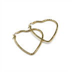 Gold hoop earrings on a white background