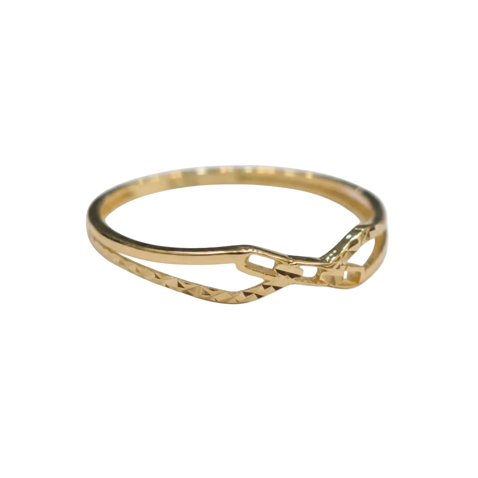 Gold ring with a diamond cut design on a white background
