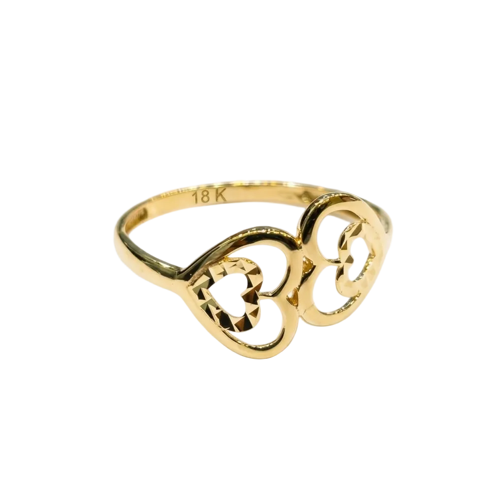 Gold ring with intricate design on a white background