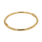 Gold bangle on a white background