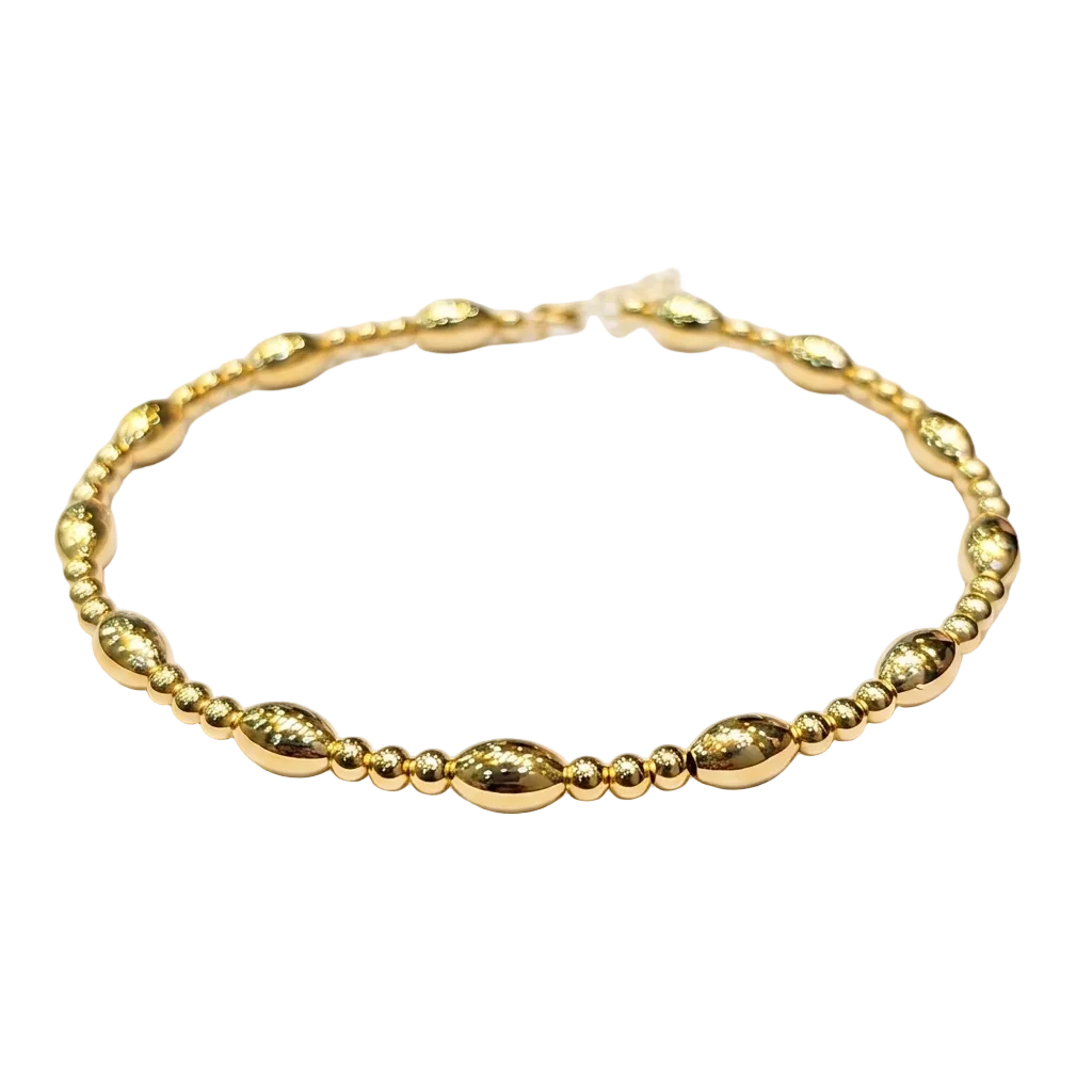 Gold bracelet on a white background