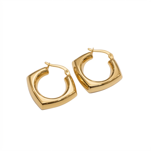 Gold hoop earrings on a white background