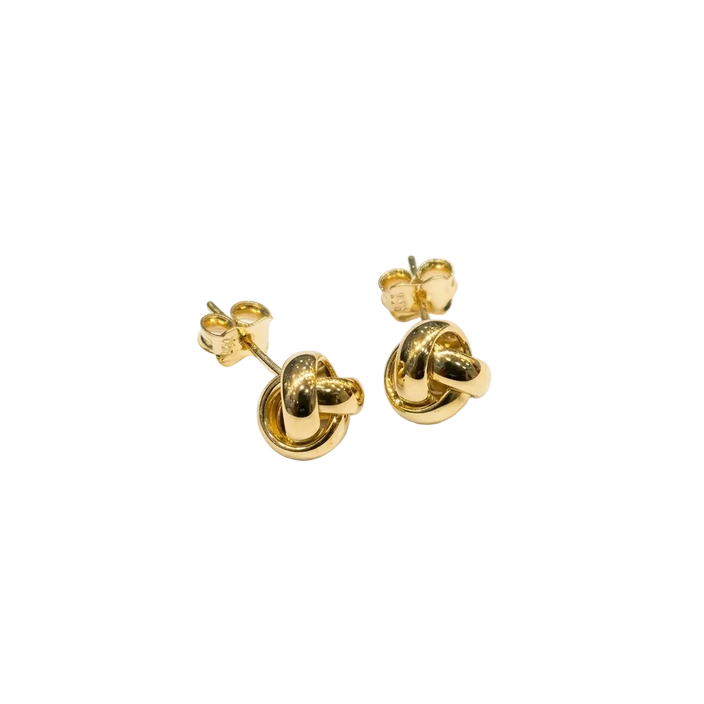 Pair of gold knot earrings on a white background