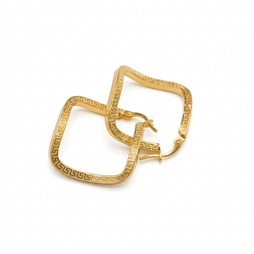Gold hoop earrings with intricate design on a white background