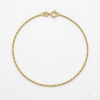 Gold bracelet on a white background