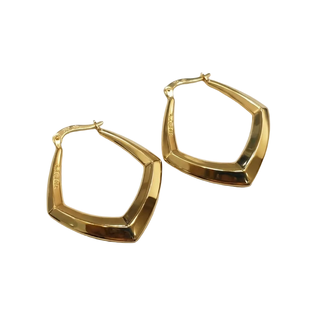 Gold hoop earrings on a white box