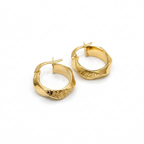 Gold hoop earrings on a white background
