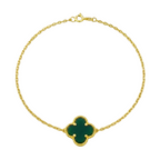 Gold bracelet with a green clover-shaped clasp on a white background