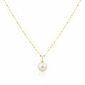 Gold necklace with a single pearl pendant on a white background