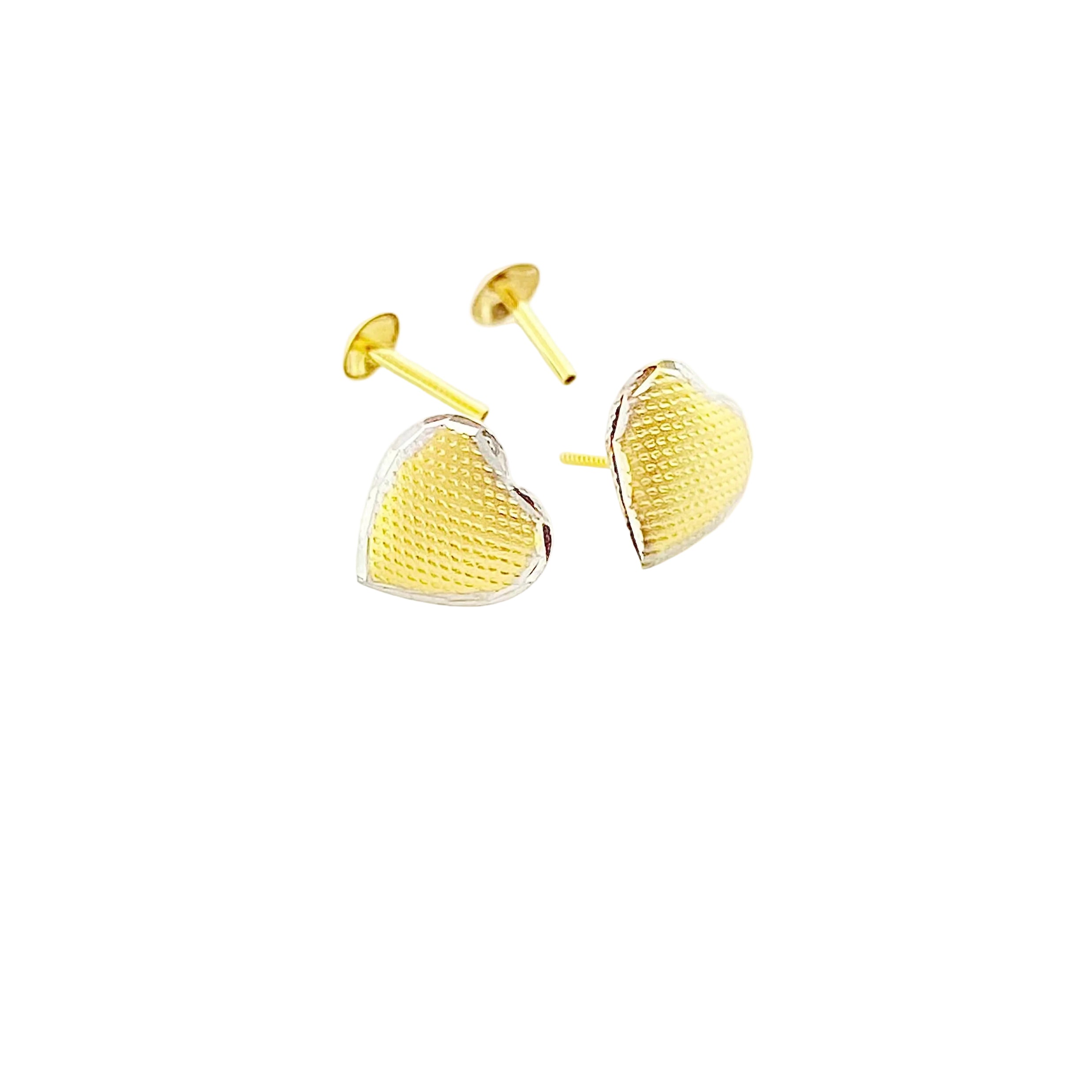 Heart-shaped gold stud earrings with textured pattern on white background