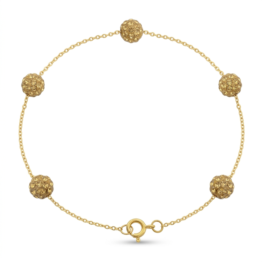 Gold bracelet with spherical beads on a white background