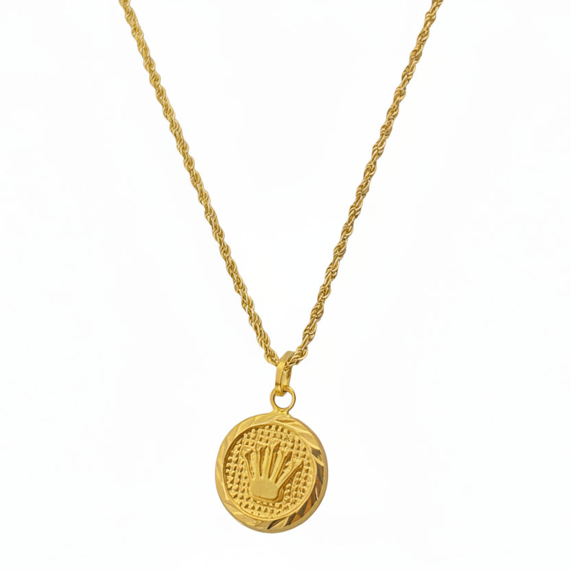 Gold necklace with a round pendant on a white background
