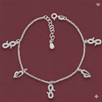 Silver bracelet with charms on a red background