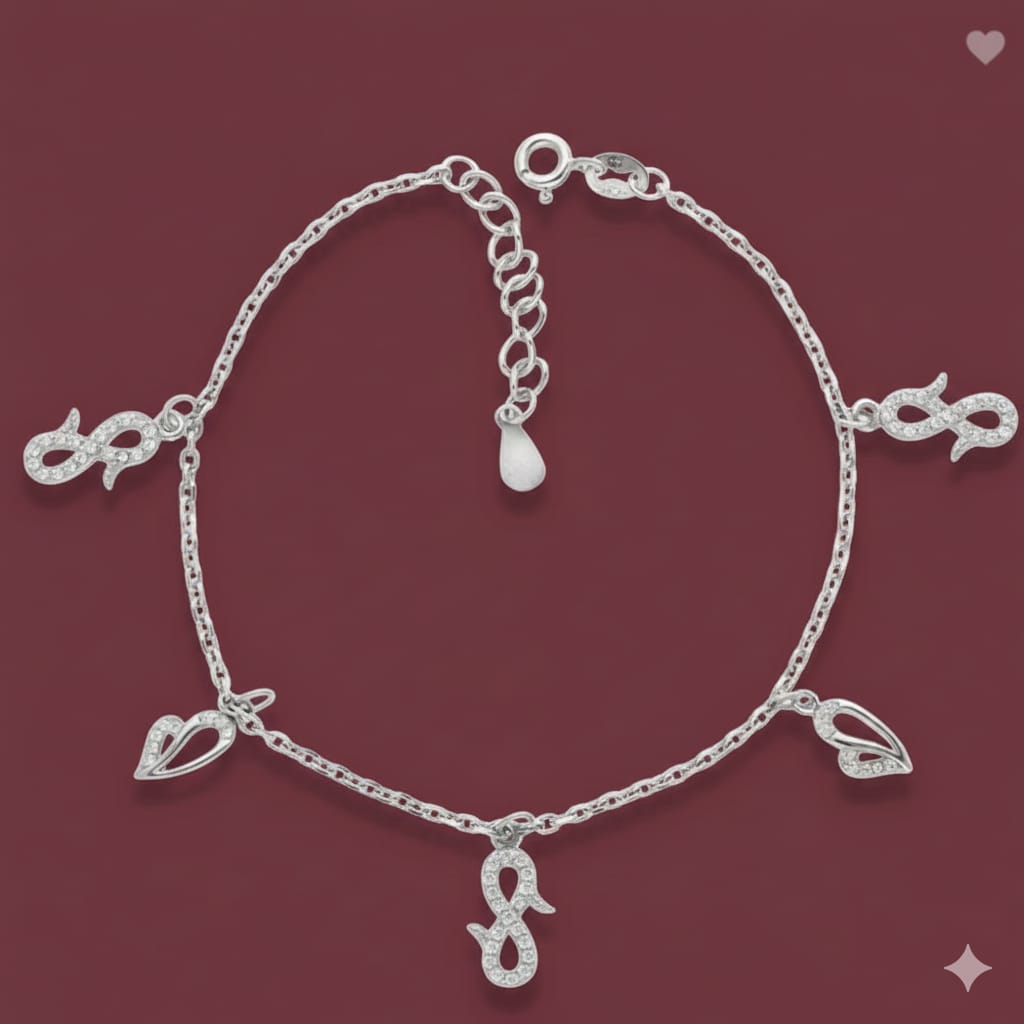 Silver bracelet with charms on a red background