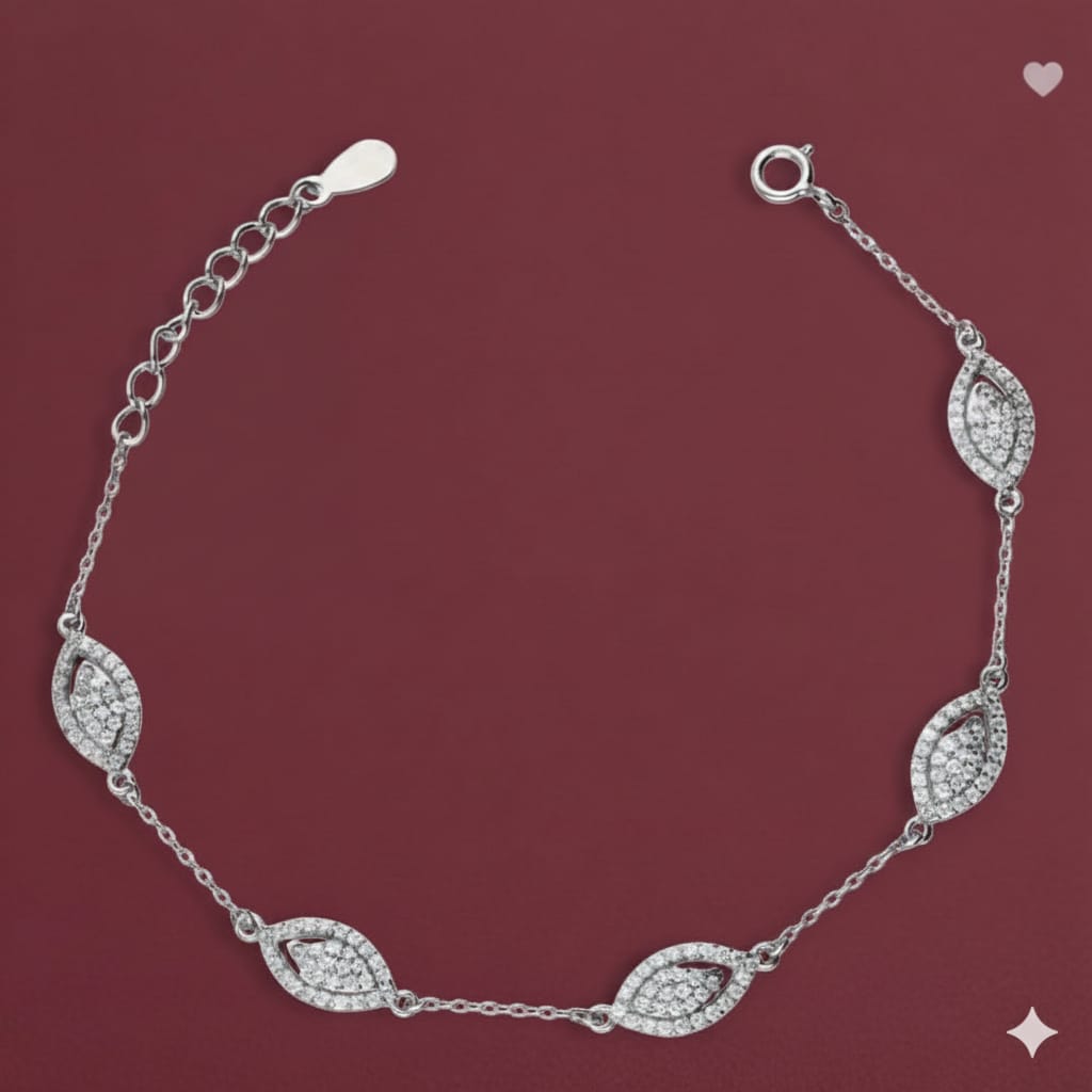 Silver bracelet with diamond-like stones on a maroon background
