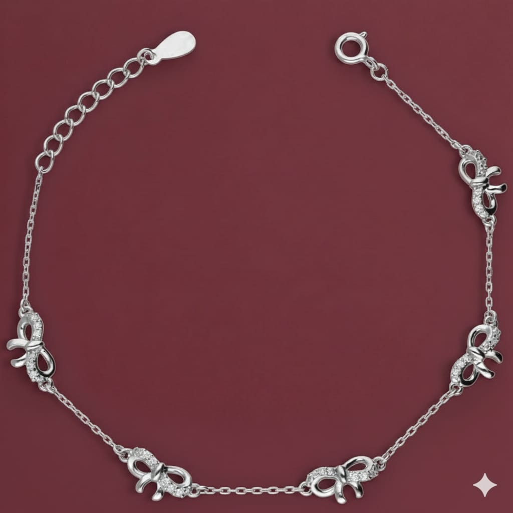 Silver bracelet with elephant charms on a red background