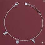Silver bracelet with charms on a red background