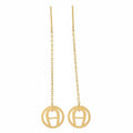 Gold earrings with circular designs on a white background