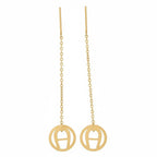 Gold earrings with circular designs on a white background