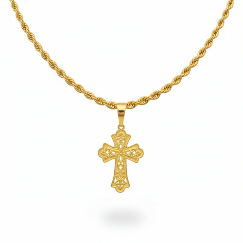 Gold necklace with a cross pendant on a black bust against a beige background