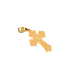 Gold cross pendant on a black background