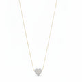 Necklace with a heart-shaped pearl pendant on a mannequin bust against a white background