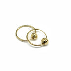 Gold hoop earrings on a gray background with weight and code information.