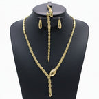 Gold necklace, bracelet, earrings, and ring set on a black mannequin with weight details.