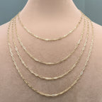Gold chain necklace on a mannequin with measurements displayed.