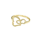Gold ring with a heart design on a gray background