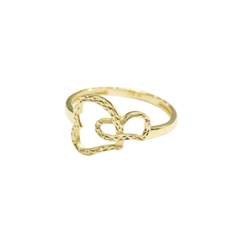 Gold ring with a heart design on a gray background