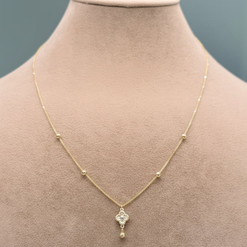 Gold necklace with a pendant on a mannequin neck, showing weight 0.89g and code C-14.