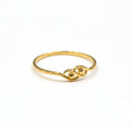 Gold ring on a gray background with weight and code label.