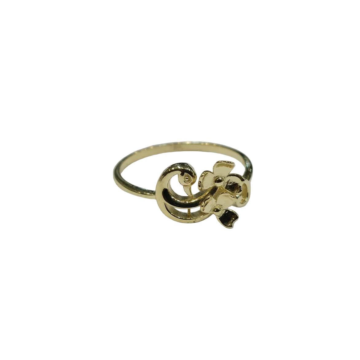 Gold ring with decorative design on a gray background