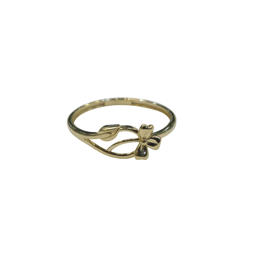 Gold ring with leaf design on a gray background
