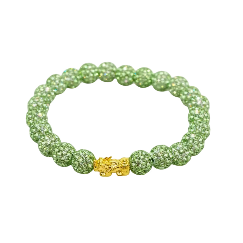 Green beaded bracelet with a gold clasp on a white background