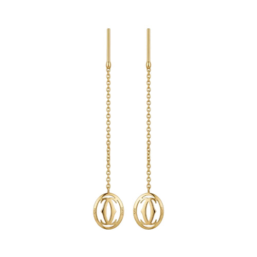 Gold earrings with chain designs on a white background