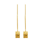 Gold earrings with square designs on a white background