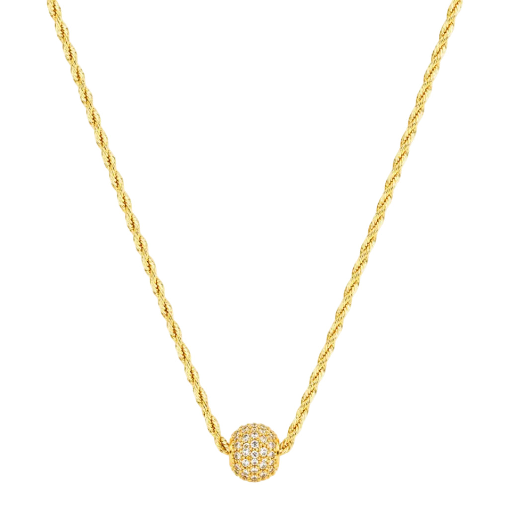 Gold necklace with a spherical pendant on a white background