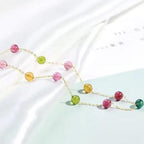 Necklace with multicolored beads on a light background