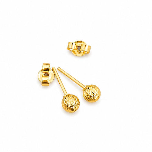 Gold earrings on a white background