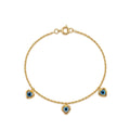 Gold bracelet with heart-shaped charms on a white background