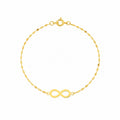 Gold bracelet with an infinity symbol on a white background