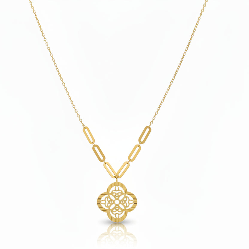 Gold necklace with a pendant on a blue mannequin