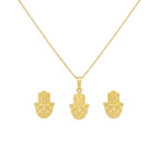 Gold hamsa hand necklace and earrings on a white background