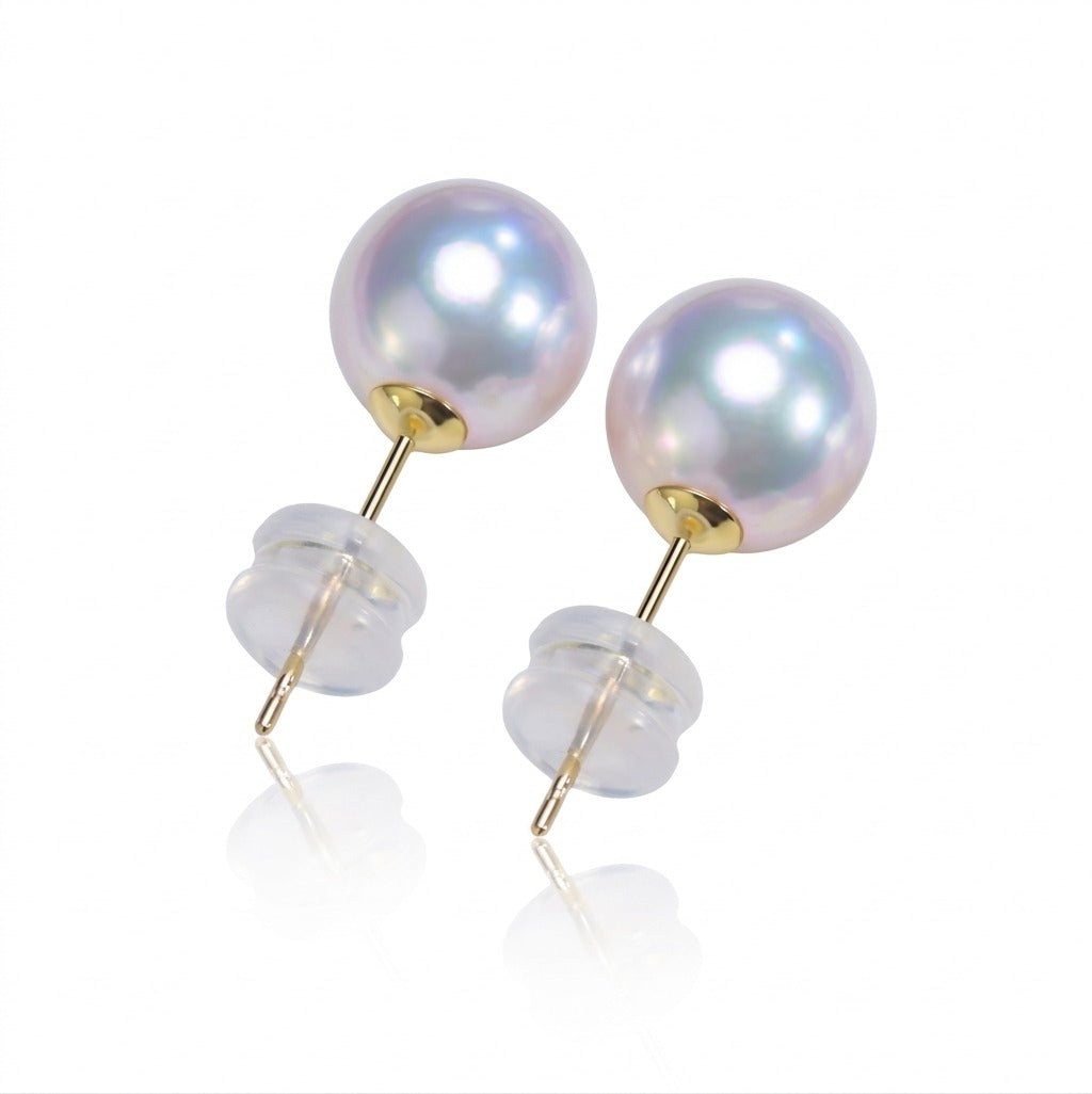 Pearl earrings with gold posts on a white background